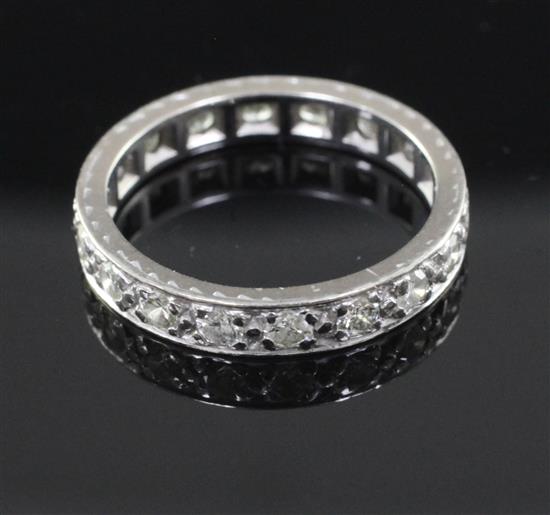 A platinum and diamond full eternity ring, size M.